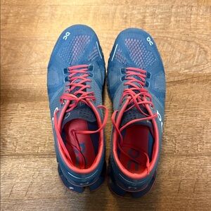 On Running Blue Sneakers with Red Laces